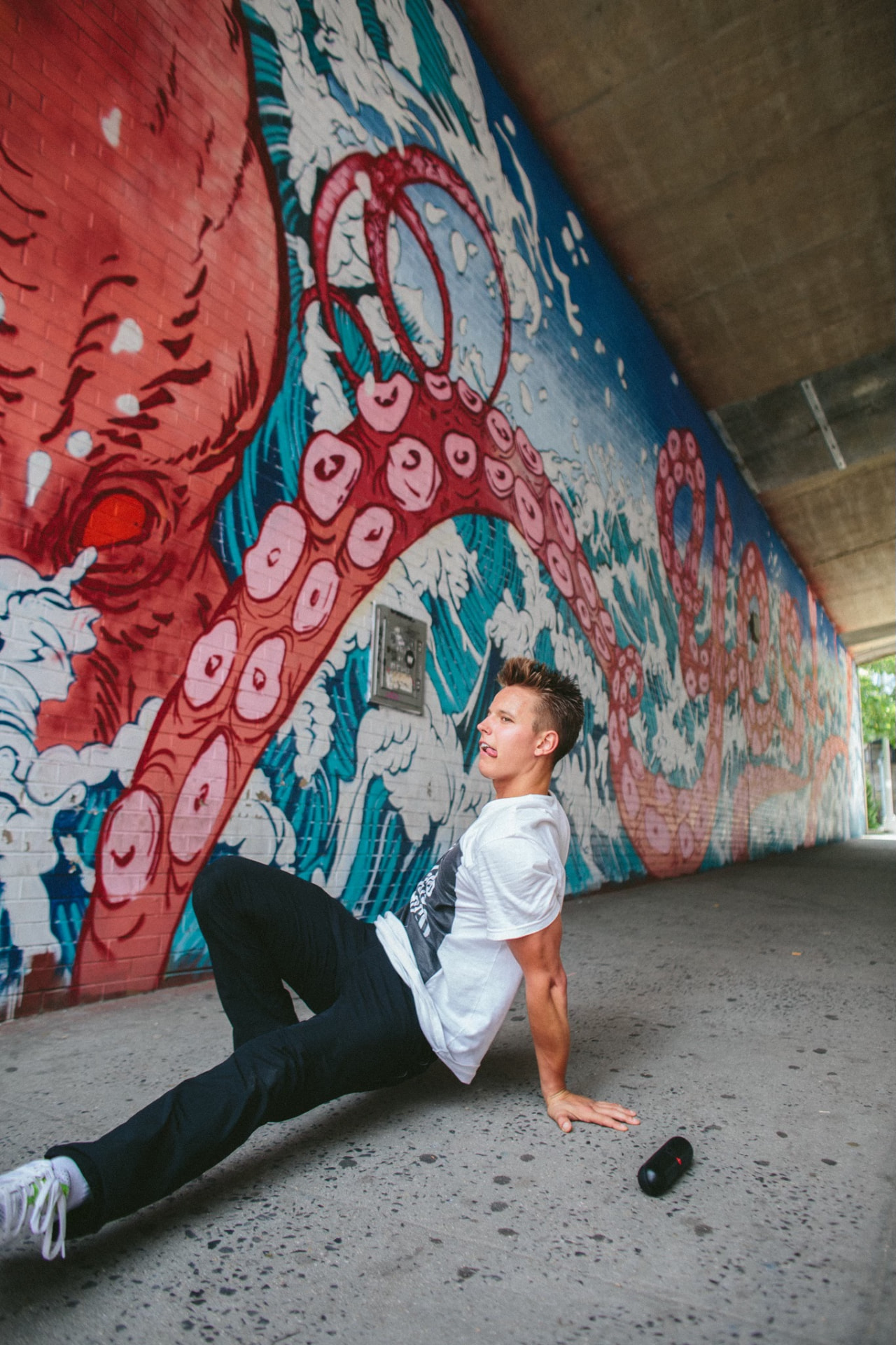 Kiefer Wiedmaier training against a painted city mural
